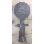 An Ashanti wooden fertility figure, length 29cm.