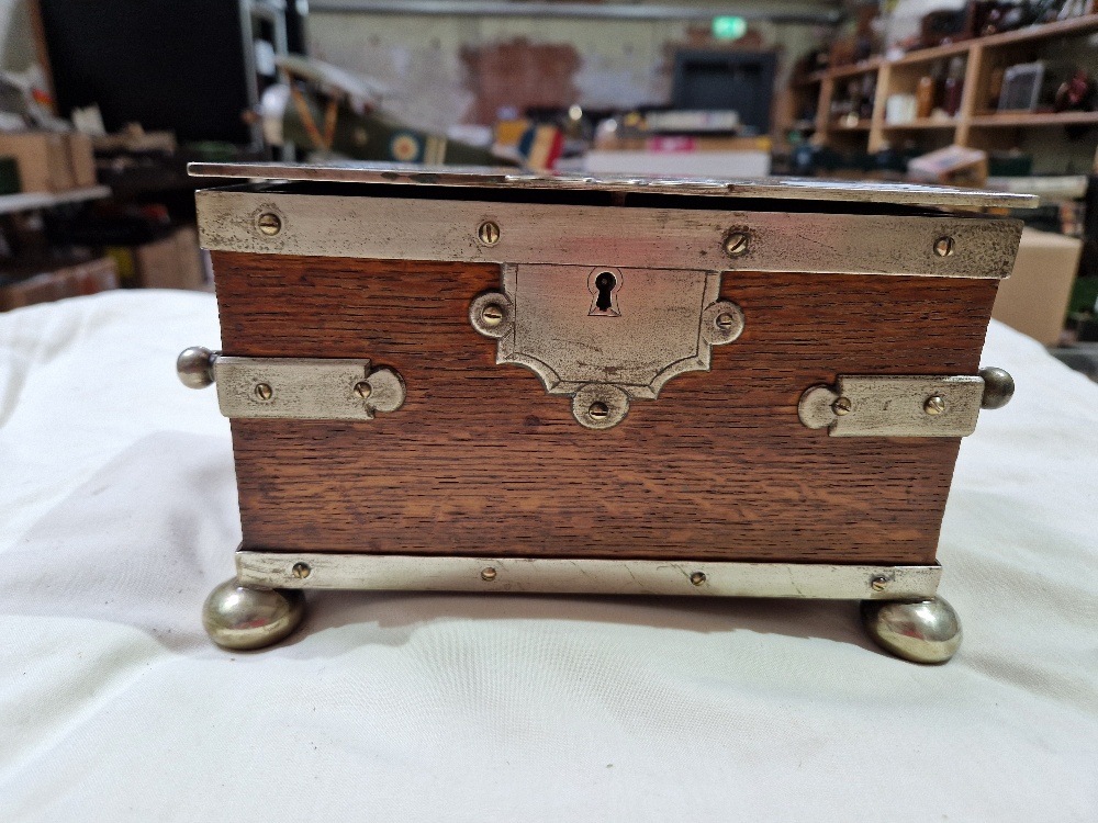 A silver plated oak tea caddy, circa 1900, the tope engraved with butterflies and acorns. - Image 5 of 7