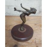 A bronze car mascot modelled as a nude lady, mounted on wooden base, height 19.5cm.