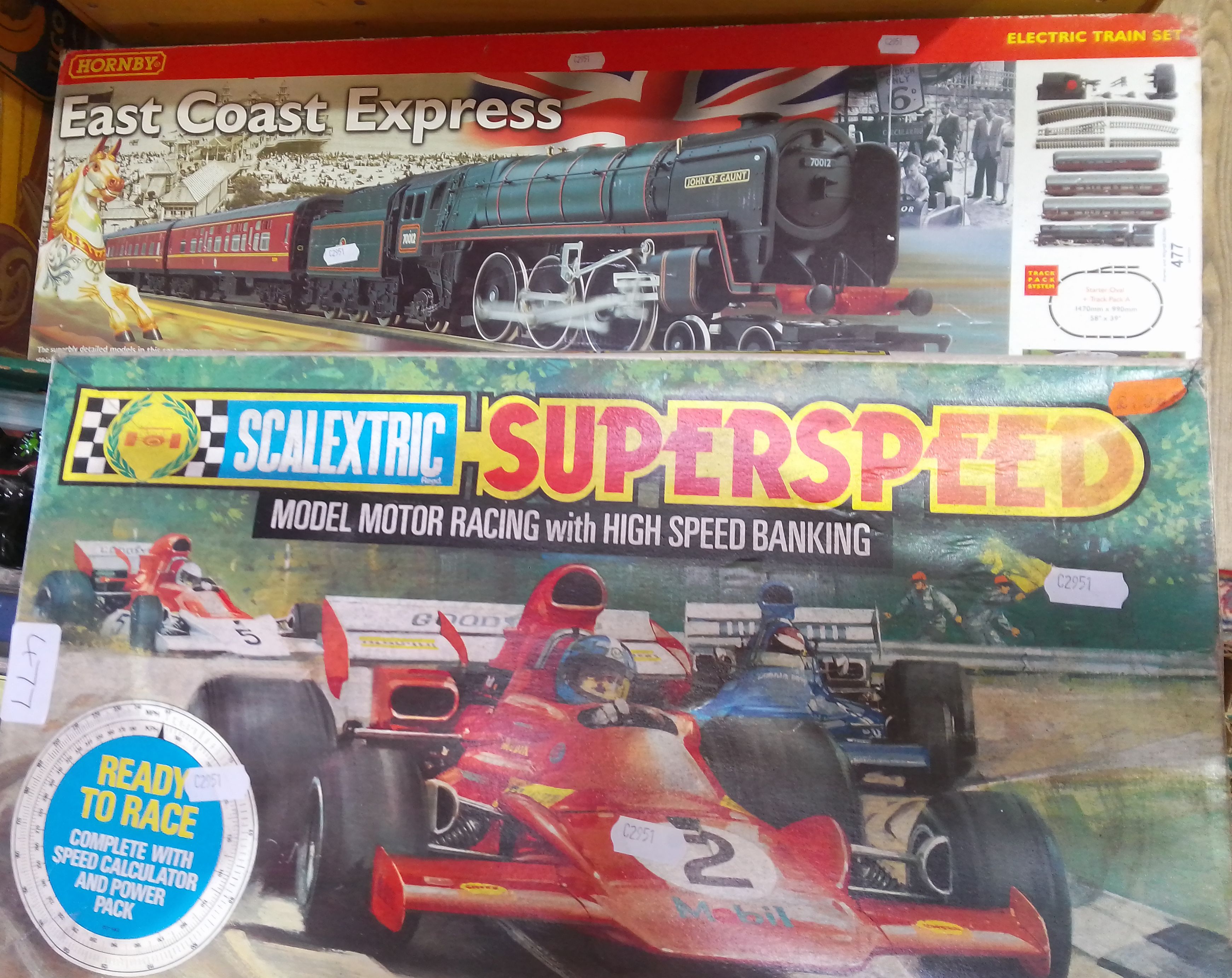 A Hornby East Coast Express electric train set and a Scalextric Super Speed set.