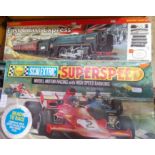 A Hornby East Coast Express electric train set and a Scalextric Super Speed set.