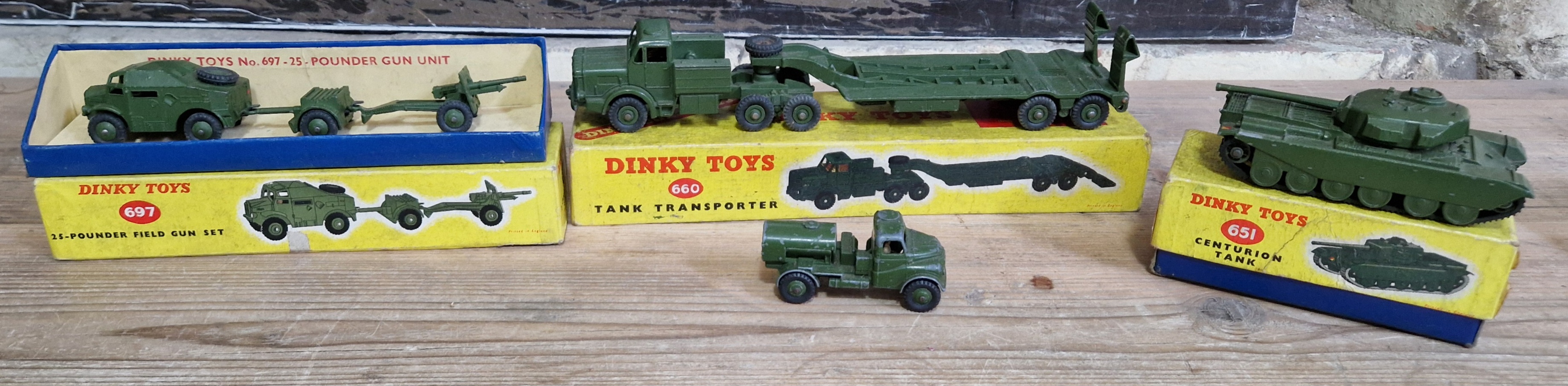 A group of four Dinky Toys military vehicles comprising of a 660 Tank Transporter (boxed), 697 25-