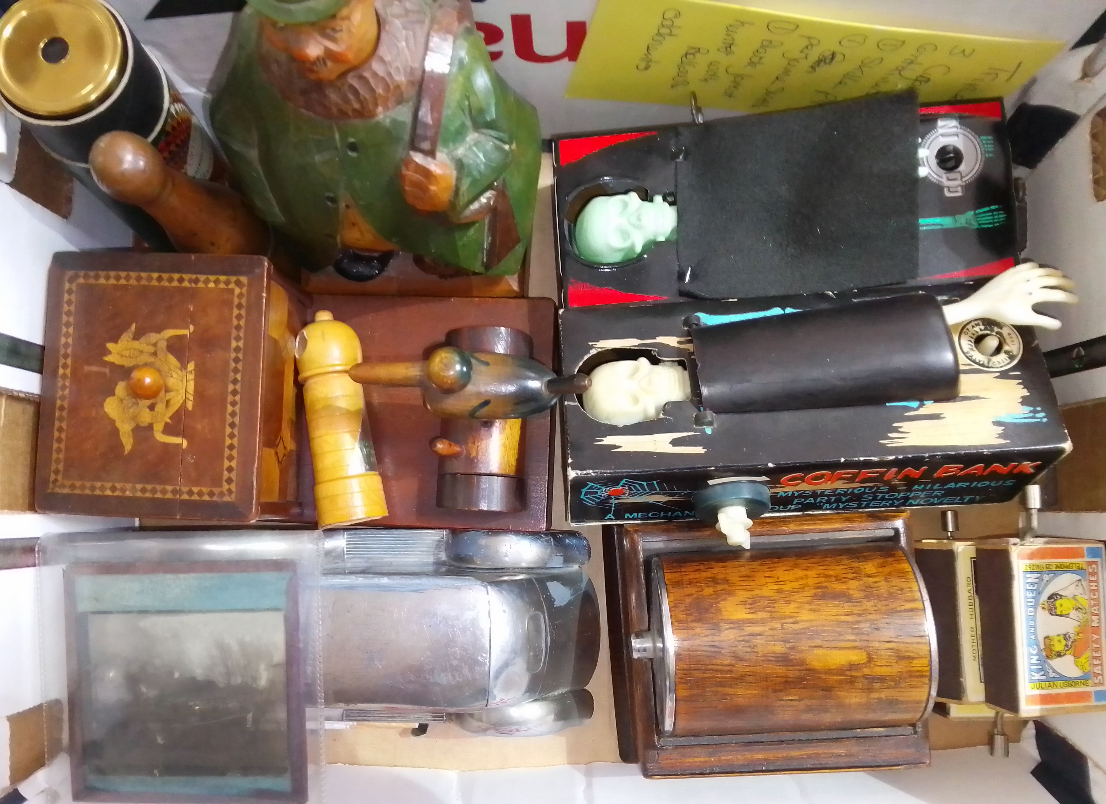 A box of assorted toys and collectables including two Hong Kong coffin money banks, carved wood,