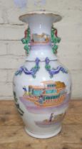 A Chinese porcelain vase, mid 19th century, decorated in over enamels with boats and figures,