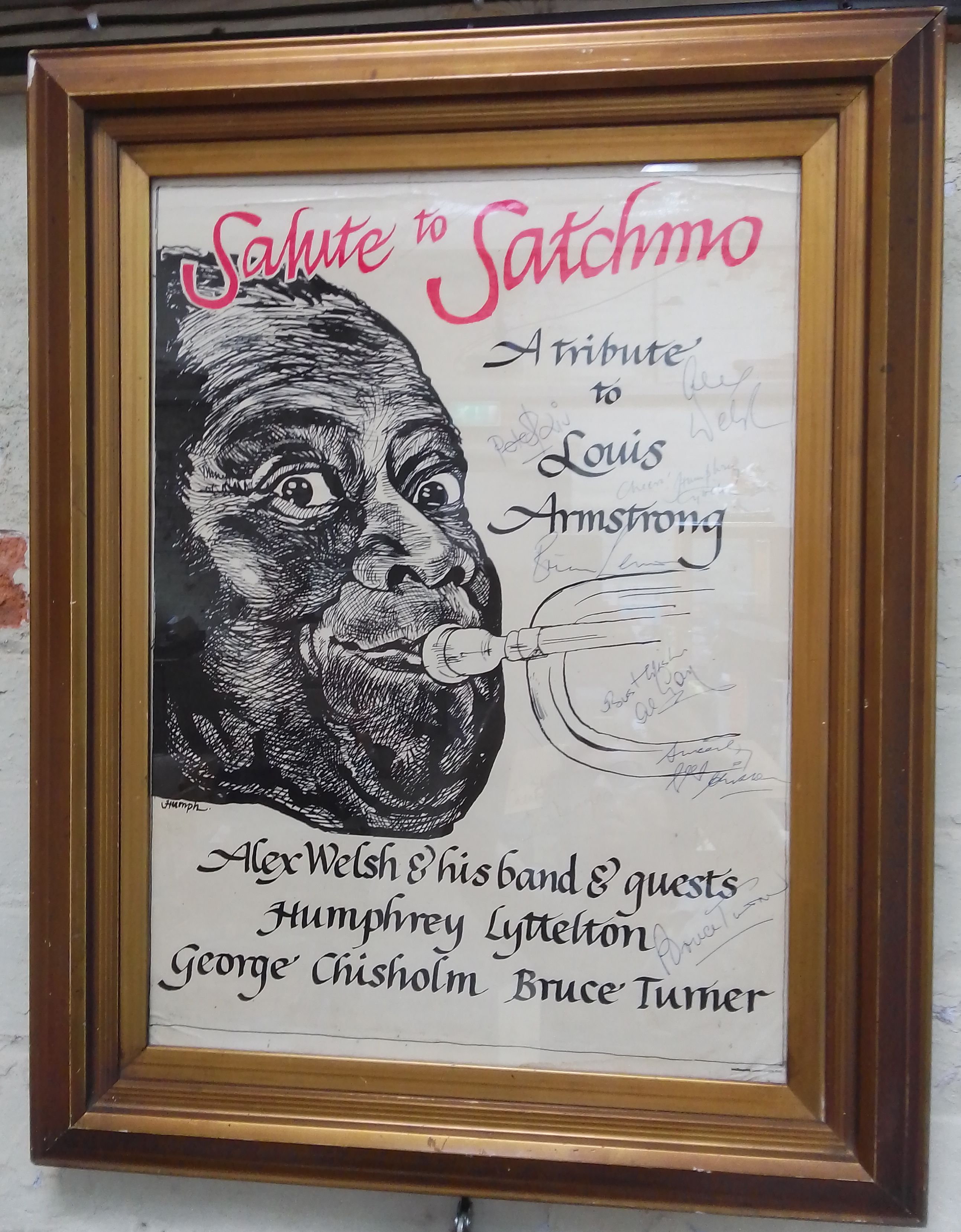 An autographed jazz poster "Salute To Satchmo", glazed and framed, total 55cm x 70cm.