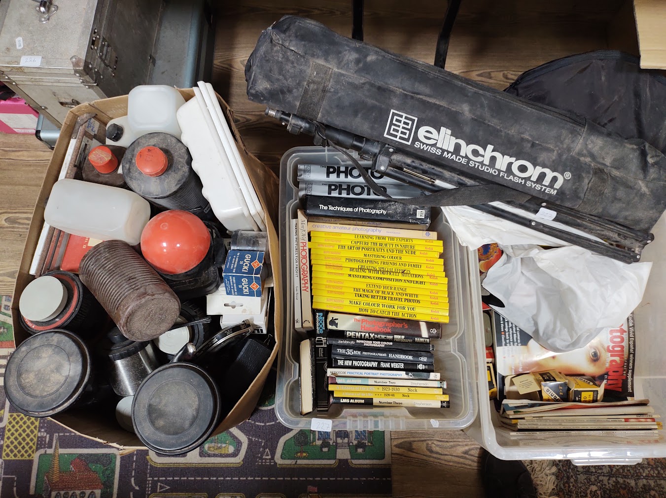 2 boxes of assorted photographic equipment & books.