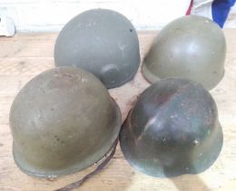 A WWII Bulgarian helmet and three others.