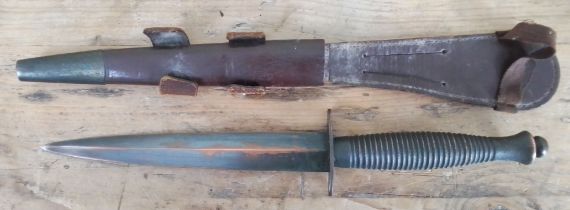 A post war Fairbairn Sykes British commando dagger and sheath.