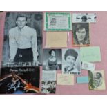 A collection of assorted autographs, including John Lennon, Ray Charles, Steven spielberg etc