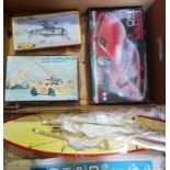 A box of toys comprising a Star pond yacht, an RC Porsche, a Tamiya Ferrari F40 unbuilt kit and