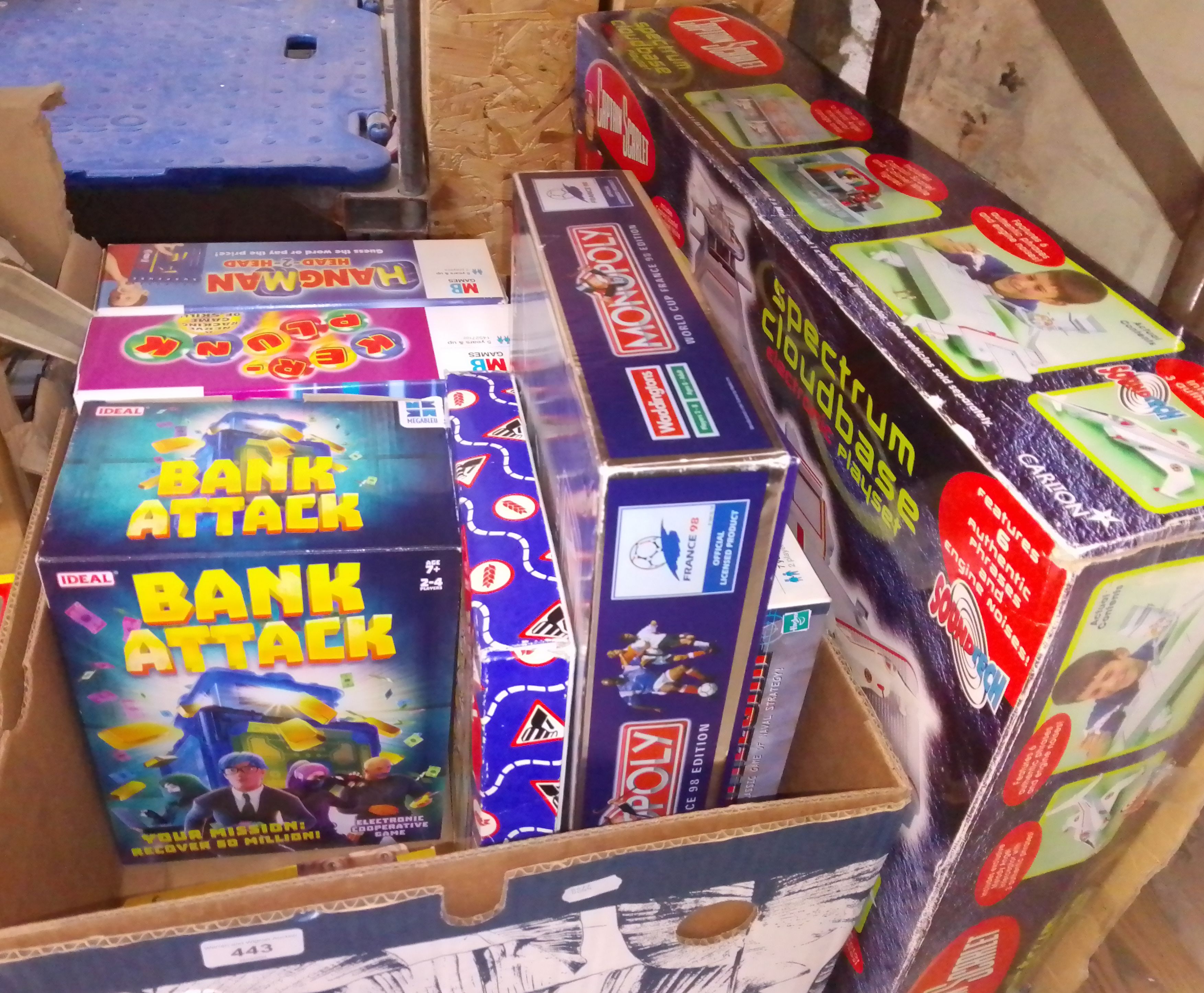 Assorted toys and games including Monopoly 1998 World Cup, Bank Attack, MB Games, Captain Scarlet
