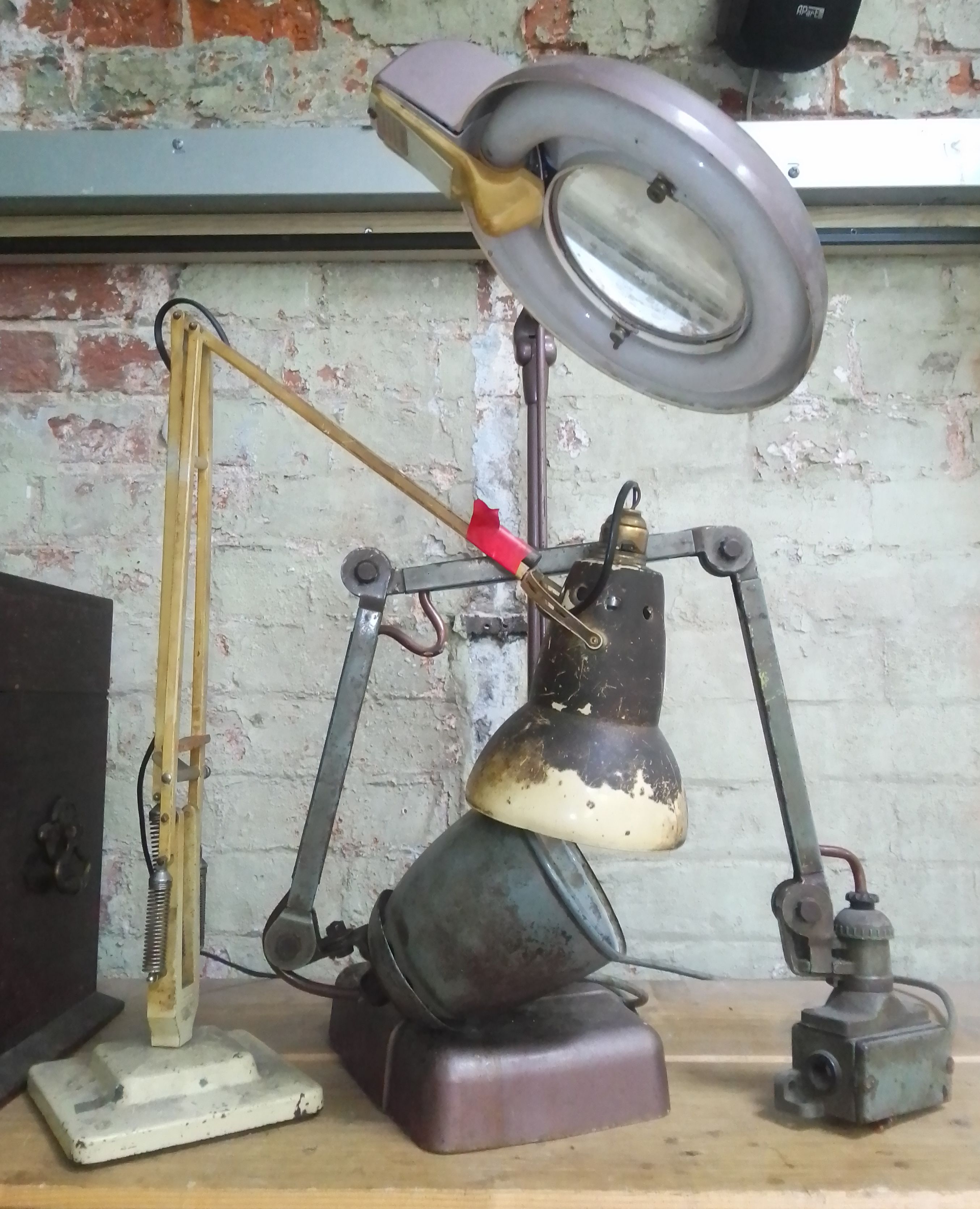 A Herbert Terry & Sons Anglepoise lamp and two other vintage angle lamps.