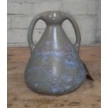 An Arts & Crafts pottery vase by Ashby Potters Guild, early 20th century, twin handled in mottled