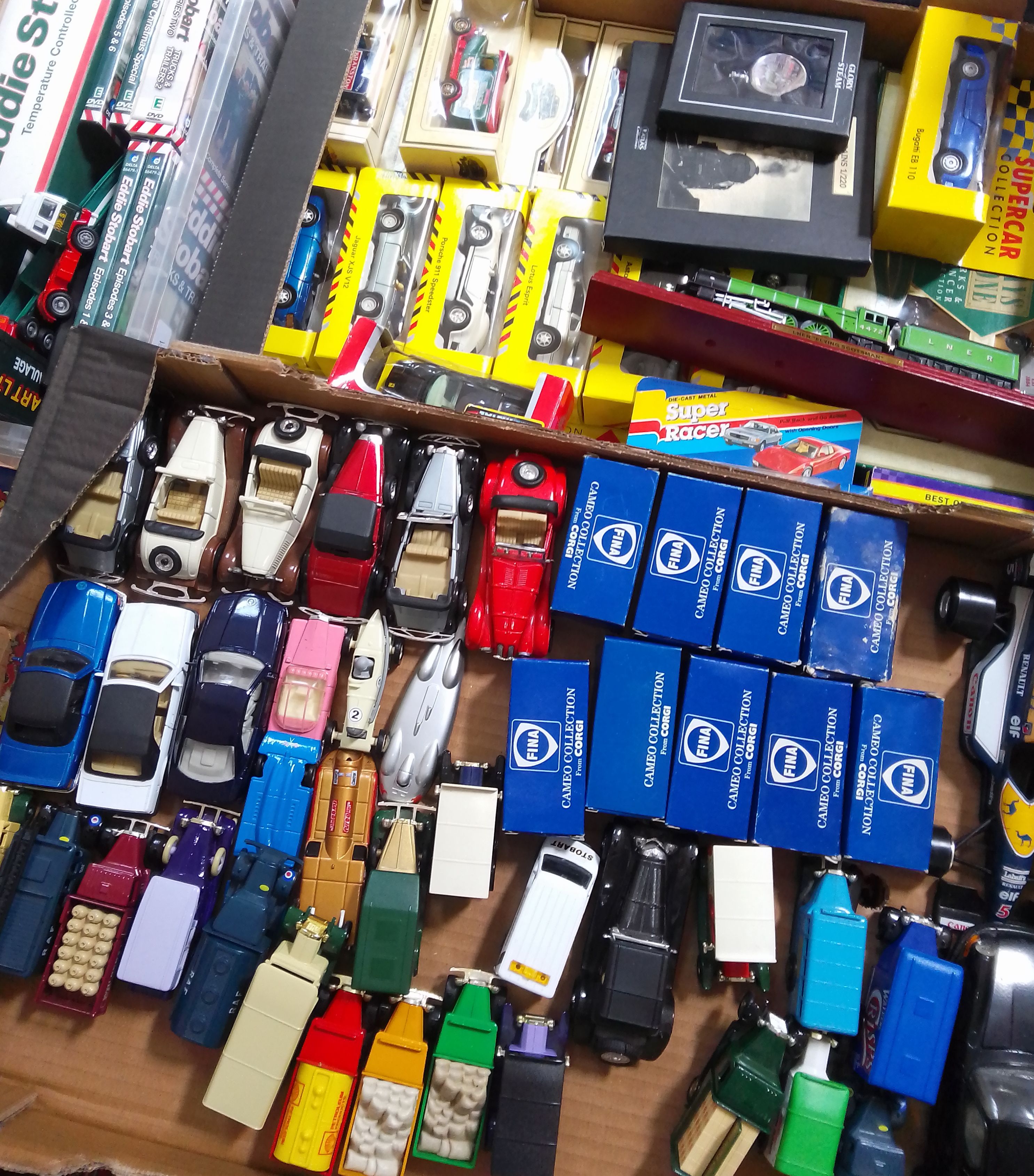 Two boxes of assorted boxed die-cast vehicles and a box of Eddie Stobbart trucks and DVDs.