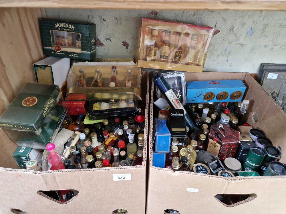 Two boxes of assorted alcoholic miniatures including numerous single malts.