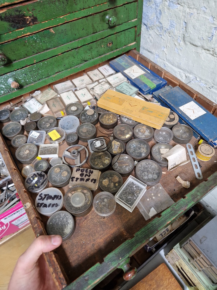 A large green horologist's chest and contents comprising watch and clock making spares. - Image 7 of 12