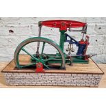 A well engineered model of a live steam beam stationary engine on simulated stone base, size of base