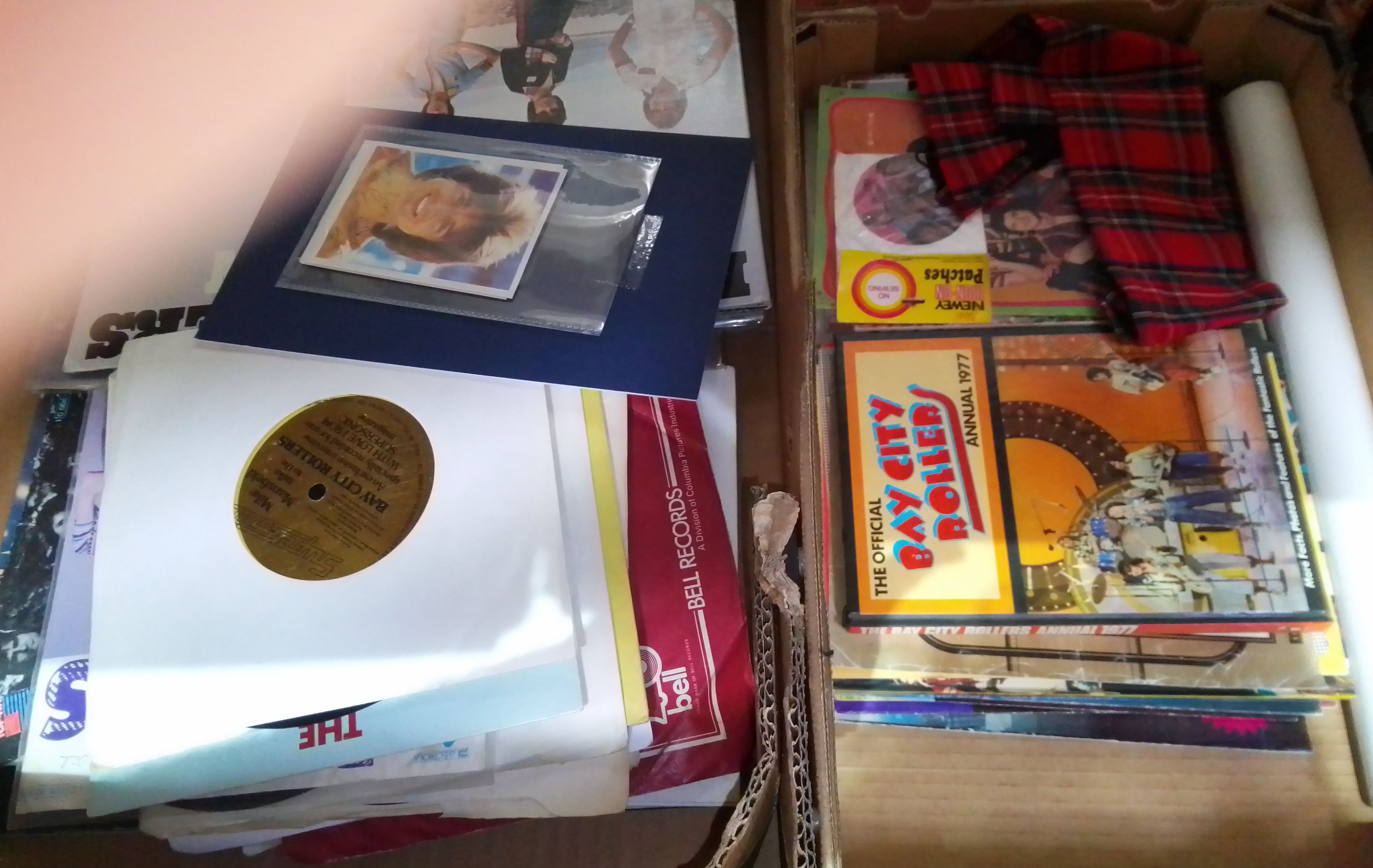 A collection of Bay City Rollers memorabilia including posters, magazines, unused iron on patch,