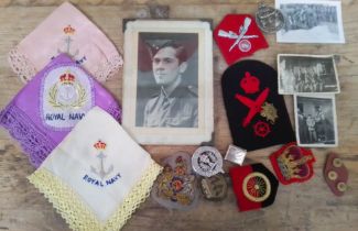 A group of assorted military badges, Royal Navy hankerchiefs & photos etc.