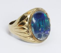 An opal triplet ring, indistinctly marked '9', gross weight 7.6g, size T.