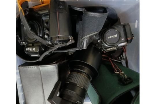 A box of assorted camera equipment including a Nikon F-501 and Nikon F4 cameras, a Sigma 170-200mm