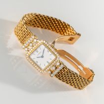 A LADY'S FINE & RARE 18K SOLID GOLD & DIAMOND CARTIER BRACELET WATCH CIRCA 1980, REF. 18002 WITH