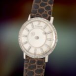 A GENTLEMAN'S SIZE 14K WHITE GOLD & DIAMOND SET LECOULTRE GALAXY MYSTERY WRIST WATCH CIRCA 1960,