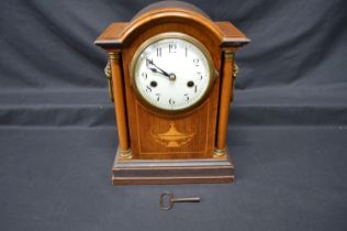Inlaid mahogany mantel clock having white enamel dial, black numerals and black hands - 12.25"