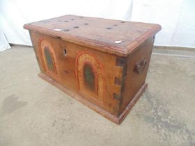 Hardwood chest with lift up lid opening to reveal right hand side candle box, the front having