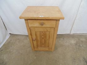 Victorian pine pot cupboard having single drawer over panelled door, standing on shaped plinth