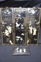 Set of four 20th century lacquered wall hanging panels having applied Mother of Pearl decoration