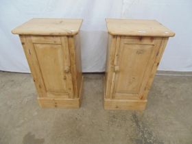 Pair of Victorian pine pot cupboards with panelled doors, standing on plinth bases - 15" x 13" x