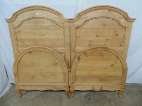 Pair of panelled arch top pine headboards on cabriole legs (with foot boards). As singles would take