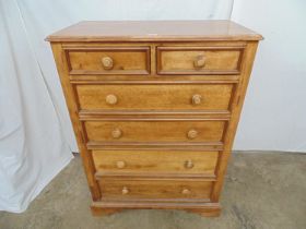 Willis & Gambier hardwood chest of two short and four long graduated drawers, standing on bracket