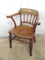 Victorian mahogany captains chair stamped JT having shaped splay arms, standing on turned legs
