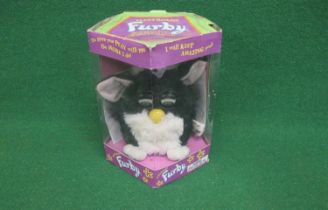 1998 Skunk Furby made by Tiger Electronics with instruction manual and Furbish-English Dictionary,