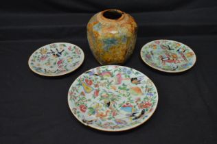 Group of three Oriental Celadon green plates with hand painted decoration of flowers and butterflies