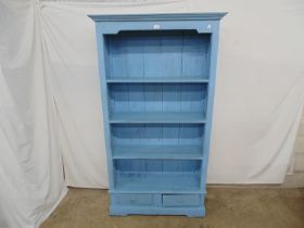 Hardwood blue painted bookcase with three fixed shelves over two drawer base, standing on bracket