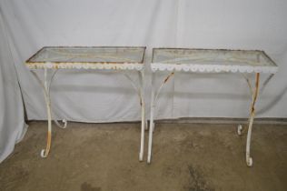 Pair of wrought iron garden side tables having glass tops and standing on scrolled legs - 31.75" x