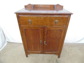 20th century oak cupboard with raised back and single long drawer over two cupboard doors