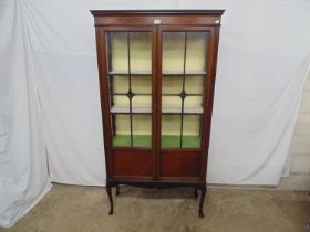Edwardian mahogany display cabinet having two glazed doors opening to three fixed shelves,