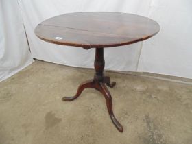 Georgian oak circular tip top occasional table with turned column standing leading three cabriole