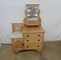 Victorian pine dressing chest/wash stand having a swing mirror and marble top with tile splash