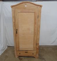 Pine single door wardrobe with arched pediment and single drawer to base, the panelled plywood