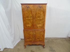 Reproduction walnut four door drinks cabinet the top doors opening to reveal a beech lined and