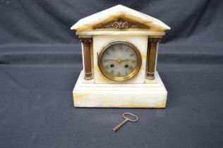Alabaster cased mantel clock of architectural form with alabaster dial and gilt Roman Numerals -