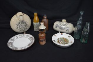 Two stoneware hot water bottles together with two warming plates and six various bottles Please note