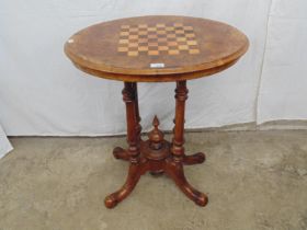 Victorian walnut inlaid chess top table having four turned legs with finial hub, standing on