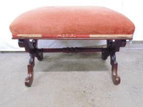 Victorian mahogany X frame stool having single stretcher, upholstered seat and standing on scroll