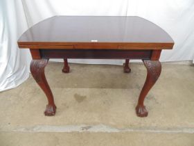 Mahogany drawleaf table the rectangular top standing on carved cabriole legs with ball and claw feet